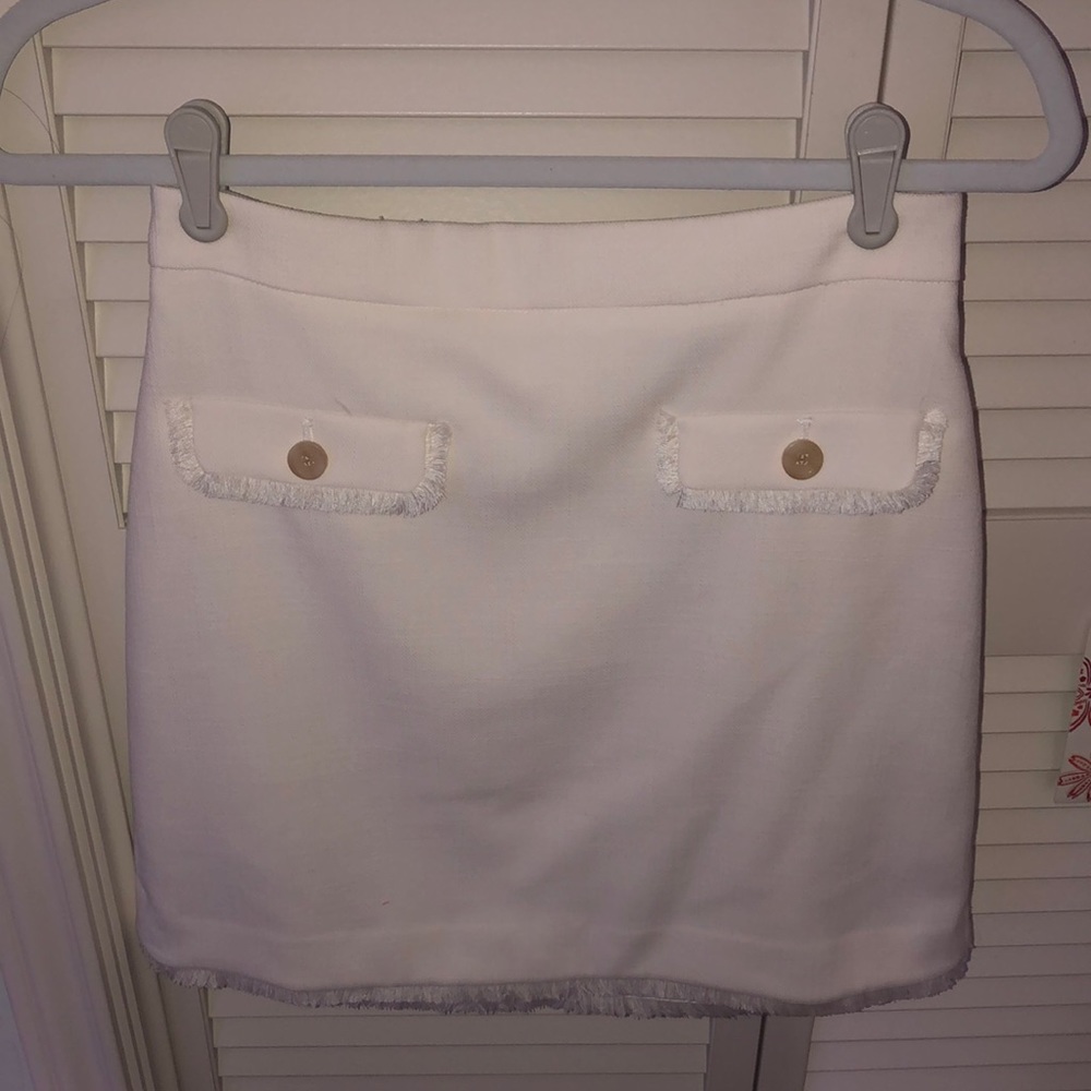 Knee length white skirt
